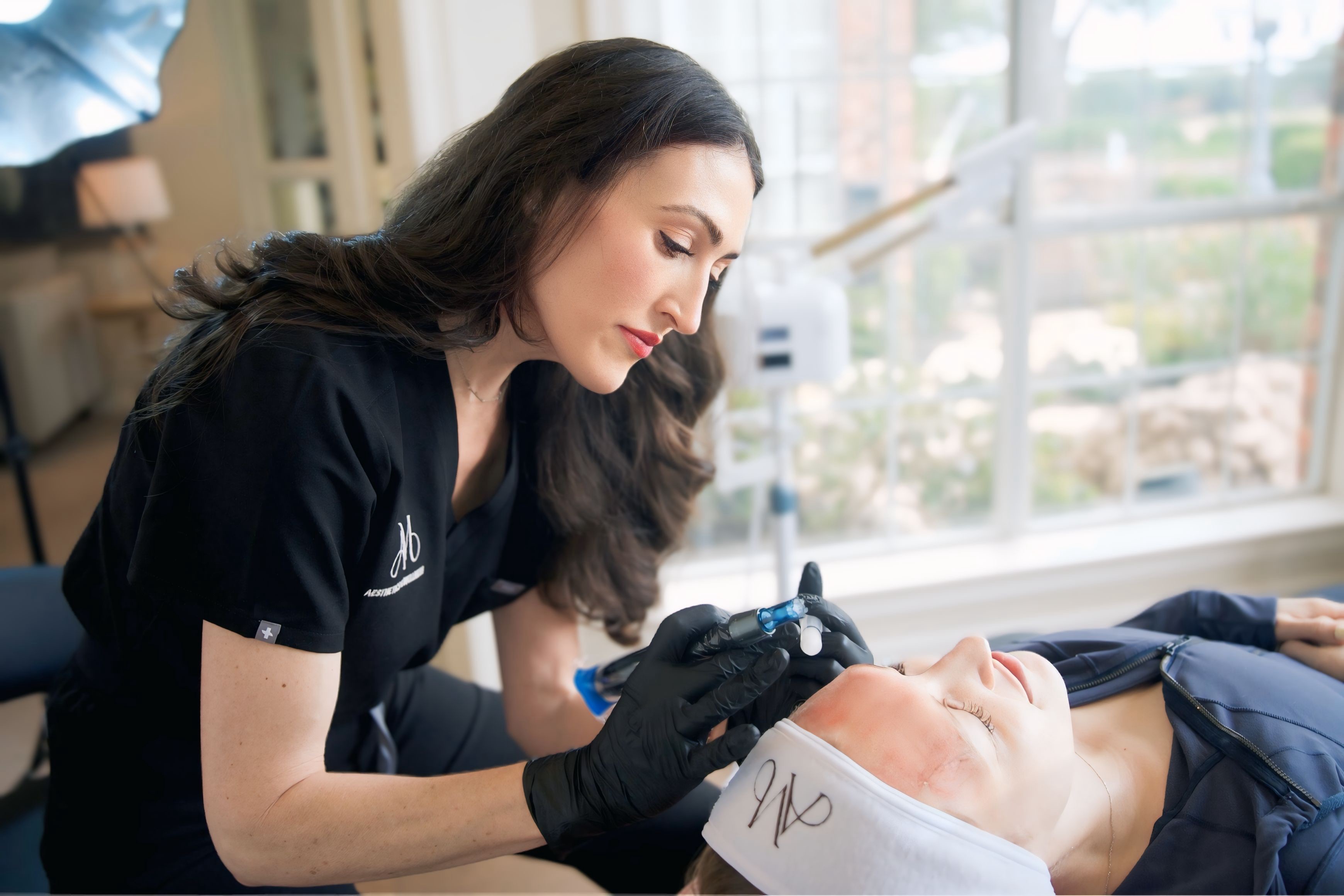 Ana Maria performing a treatment in natural light.